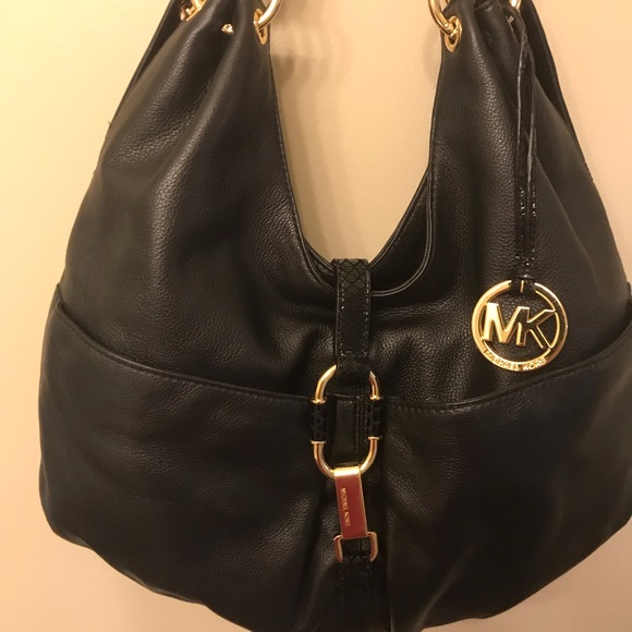 Michael Kors Handbags - Beautiful large MK bag with dust cover .